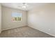 Neutral bedroom with a ceiling fan and a window with neighborhood views at 3609 Kingfishers Catch Ave, North Las Vegas, NV 89084