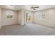 Spacious bedroom features neutral walls, carpet flooring, a sliding glass door, and two windows at 3609 Kingfishers Catch Ave, North Las Vegas, NV 89084