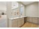 Butler's pantry with granite countertops and cabinet storage at 3609 Kingfishers Catch Ave, North Las Vegas, NV 89084