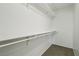 Walk-in closet with built-in shelving and neutral carpeting at 3609 Kingfishers Catch Ave, North Las Vegas, NV 89084