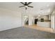 Bright living room featuring carpet flooring and views to the kitchen at 3609 Kingfishers Catch Ave, North Las Vegas, NV 89084