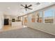Open-concept living room featuring carpet flooring, recessed lighting, and a ceiling fan at 3609 Kingfishers Catch Ave, North Las Vegas, NV 89084