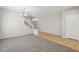 Carpeted living room next to tiled entryway and staircase at 3609 Kingfishers Catch Ave, North Las Vegas, NV 89084