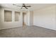 Spacious living room featuring neutral walls, carpet floors, ceiling fan, and recessed wall design at 3609 Kingfishers Catch Ave, North Las Vegas, NV 89084