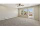 Loft area with neutral carpeting, ceiling fan, and bright natural light at 3609 Kingfishers Catch Ave, North Las Vegas, NV 89084