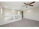 Upstairs loft area featuring neutral carpeting and a ceiling fan at 3609 Kingfishers Catch Ave, North Las Vegas, NV 89084