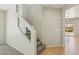 Staircase with carpeted steps and glass panel at 3609 Kingfishers Catch Ave, North Las Vegas, NV 89084
