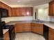 Well-lit kitchen featuring wood cabinets and modern appliances at 3813 Juanita May Ave, North Las Vegas, NV 89032