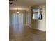A spacious living room with tile floors and natural light at 3813 Juanita May Ave, North Las Vegas, NV 89032