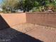 A private patio area features a brick floor and a rock garden at 3813 Juanita May Ave, North Las Vegas, NV 89032