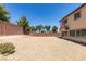 Expansive gravel backyard is perfect for creative landscaping and outdoor living at 3941 Copper Stone Ct, North Las Vegas, NV 89032