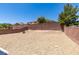 A vast backyard with gravel, ideal for personalization and outdoor activities at 3941 Copper Stone Ct, North Las Vegas, NV 89032