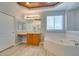 Bright bathroom featuring a tub, white tile, a vanity area, and wood-look flooring at 3941 Copper Stone Ct, North Las Vegas, NV 89032
