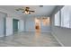 A bedroom features double doors and light gray walls, complemented by wood-look floors at 3941 Copper Stone Ct, North Las Vegas, NV 89032