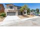 Inviting two-story home featuring a well-kept front yard, neutral stucco, and a convenient two-car garage at 3941 Copper Stone Ct, North Las Vegas, NV 89032