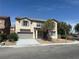 Two-story home featuring a two-car garage and drought tolerant landscaping at 3941 Copper Stone Ct, North Las Vegas, NV 89032