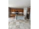 Updated kitchen with stainless steel appliances, a center island, and ample storage at 3941 Copper Stone Ct, North Las Vegas, NV 89032