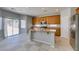 Well-lit kitchen showcasing a central island, stainless steel appliances, and ample cabinet space at 3941 Copper Stone Ct, North Las Vegas, NV 89032