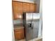 Kitchen with stainless steel refrigerator and wooden cabinets and countertops at 3941 Copper Stone Ct, North Las Vegas, NV 89032