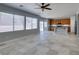Open concept: Kitchen with stainless steel appliances and island, flowing into the living area at 3941 Copper Stone Ct, North Las Vegas, NV 89032