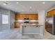 Bright kitchen showcases stainless steel appliances, a large island, and tile flooring at 3941 Copper Stone Ct, North Las Vegas, NV 89032
