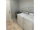 Laundry room with a sink, washer, and dryer hookups for convenience at 3941 Copper Stone Ct, North Las Vegas, NV 89032