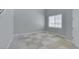 Neutral living space with tile floor, natural light, ready for personal touches at 3941 Copper Stone Ct, North Las Vegas, NV 89032