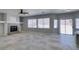 Spacious living room featuring tile floors, a fireplace, and sliding glass doors to the outdoor area at 3941 Copper Stone Ct, North Las Vegas, NV 89032