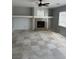 Spacious living room with a fireplace, built-ins, tile flooring, and natural light at 3941 Copper Stone Ct, North Las Vegas, NV 89032