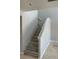 Bright staircase featuring wood-look steps and neutral wall paint leading to the upper level at 3941 Copper Stone Ct, North Las Vegas, NV 89032