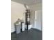 Garage corner showcasing the water heater and water softener system at 3941 Copper Stone Ct, North Las Vegas, NV 89032