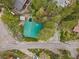 Aerial view of charming cabin with green roof surrounded by lush greenery at 401 Alpine Way, Mount Charleston, NV 89124