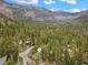 Aerial view of a mountain community with lush trees, mature landscaping, and desirable mountain views at 401 Alpine Way, Mount Charleston, NV 89124