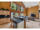 Bright kitchen with granite countertops, wooden cabinets, and scenic views from large windows at 401 Alpine Way, Mount Charleston, NV 89124