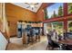 Open kitchen with bar seating, stainless steel appliances, and cozy dining area with beautiful backyard view at 401 Alpine Way, Mount Charleston, NV 89124