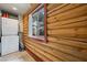 Cozy laundry area with window and log walls at 401 Alpine Way, Mount Charleston, NV 89124