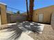 Private backyard offers low-maintenance gravel landscaping and shaded patio area at 453 Las Casitas Way, Las Vegas, NV 89121