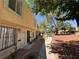 Side view of exterior showing walkway with garden featuring well maintained plants and bushes at 453 Las Casitas Way, Las Vegas, NV 89121