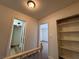 Upstairs hallway with view to the bedrooms featuring built in shelving at 453 Las Casitas Way, Las Vegas, NV 89121