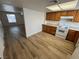 The kitchen showcases ample light, modern flooring, and white appliances at 453 Las Casitas Way, Las Vegas, NV 89121