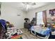 Bedroom with dual beds, gaming setup, and themed posters, perfect for or guests at 517 5Th St, Boulder City, NV 89005
