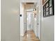 Bright hallway with access to multiple rooms and natural colored flooring at 517 5Th St, Boulder City, NV 89005
