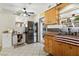Modern kitchen featuring stainless steel appliances, tile floors, and light wood cabinets at 517 5Th St, Boulder City, NV 89005