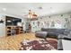 Spacious living room with hardwood floors, a comfortable grey sectional sofa, and an entertainment center at 517 5Th St, Boulder City, NV 89005