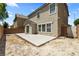 Spacious backyard with a concrete patio next to the house at 5824 Gemstone Peak St, North Las Vegas, NV 89031