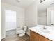 Bathroom featuring a single vanity, toilet, towel rack, and an open door to the walk-in closet at 5824 Gemstone Peak St, North Las Vegas, NV 89031