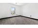 Simple bedroom with natural light and carpet floors at 5824 Gemstone Peak St, North Las Vegas, NV 89031