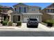 Charming two-story home featuring a two-car garage and manicured front yard at 5824 Gemstone Peak St, North Las Vegas, NV 89031