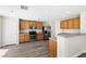 Spacious kitchen with stainless steel appliances, oak cabinets and light grey countertop at 5824 Gemstone Peak St, North Las Vegas, NV 89031