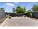 Low-maintenance backyard with gravel landscaping, modern planters, and a secure block wall at 620 Painted Cloud Pl, Las Vegas, NV 89144